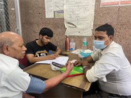 Lab technician assessing the Blood Pressure of patient attending NCD clinic